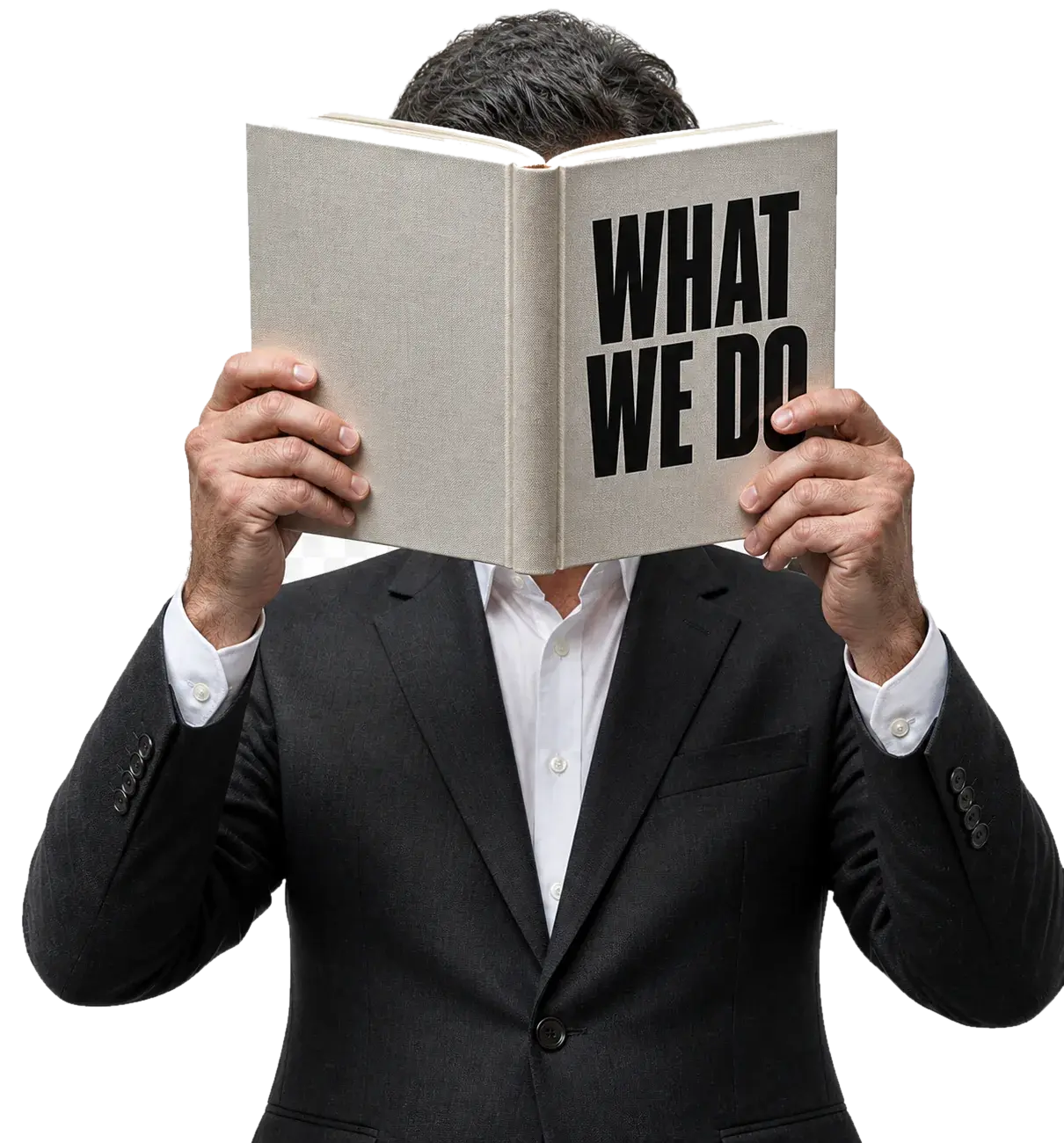 A man in a dark suit holding an open book up in front of his face; the pages read “What we do”.